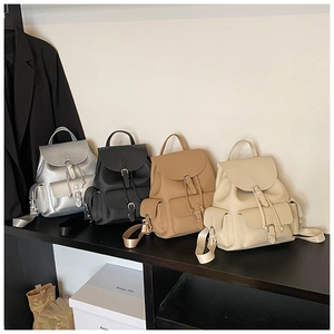 Detailed view of leather backpacks in four colors with flap closure and buckle straps