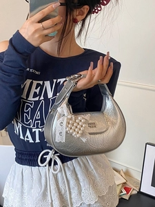 Chic silver metallic crescent hobo bag with heart pearl charm and bow details