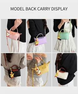 Detailed views of various color options shown on models with cute duck pendant