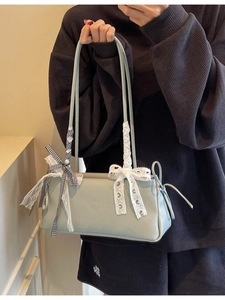 Mint green textured faux leather tote bag with lace bow and plaid ribbon details