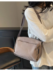 Fashionable taupe nylon crossbody bag with multi-compartments and adjustable strap