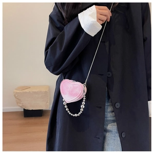 Pink heart-shaped mini crossbody bag with embossed lettering and silver bead chain detail