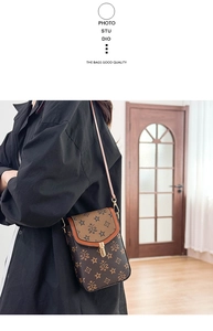 Detail of vintage crossbody square bag showing retro pattern and gold metal clasp