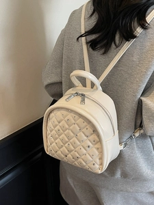 Creamy white quilted mini backpack for women with sparkling rhinestone accents