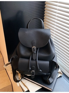 Minimalist black lychee texture backpack with metal buckle and functional pockets