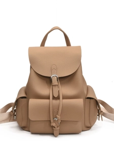 Minimalist beige pebble leather backpack with front buckle pocket and adjustable straps