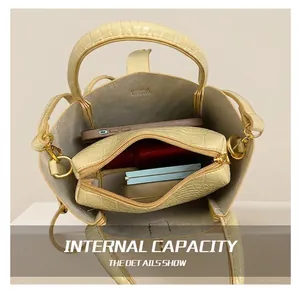 Interior view of beige crocodile embossed bucket bag showing high capacity storage