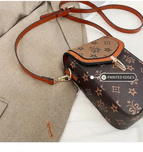 Detail of oil edge craftsmanship on retro brown monogram crossbody bag with gold lock