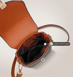Detailed interior view of vintage pattern shoulder bag showing main compartment and pocket