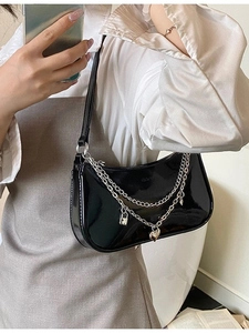 Fashionable black patent leather crescent hobo bag with silver heart chain charms