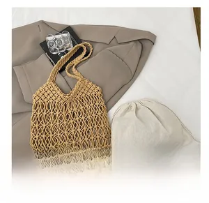 Detail showing handwoven hollow shoulder bag with a canvas drawstring inner pouch