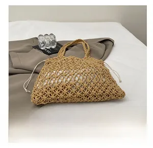 Detail of hollow woven cotton bag with white drawstring liner on a clean surface