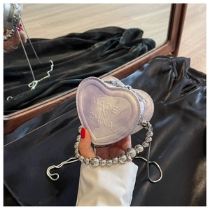 Detailed view of lavender marble heart mini bag with chunky silver bead handle