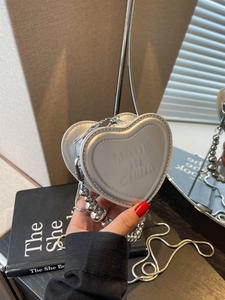 Silver heart shaped mini crossbody bag with metal bead handle and fine chain strap