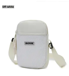 Detail of a cream white crossbody phone bag featuring a breathable mesh front pocket