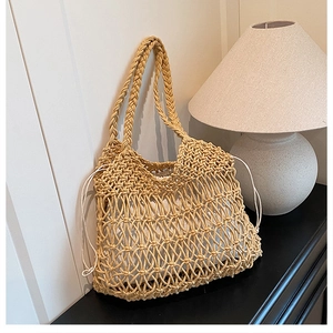 Detail of hollow woven cotton tote bag with white canvas drawstring liner and handles
