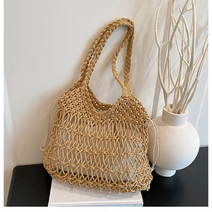 Close-up of bohemian hollow cotton woven tote with a secure white canvas drawstring liner