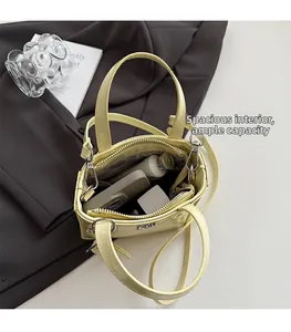 Internal view of shiny yellow tote bag showing large capacity and zipper pocket