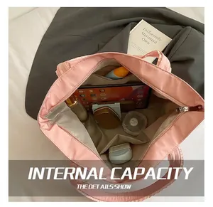 Pink tote bag interior showing large capacity for tablet, cosmetics, and accessories