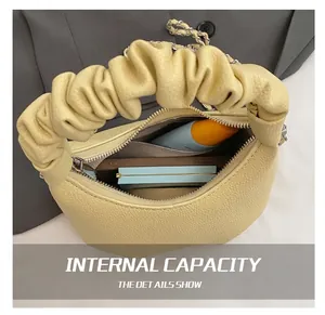Detailed interior view of the silver underarm bag showing the spacious inner compartment