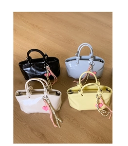 Collection of chic tote bags in black blue beige and yellow with heart charms