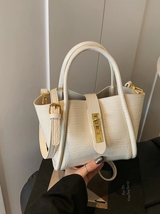 Chic beige crocodile texture bucket bag with gold lock and adjustable shoulder strap
