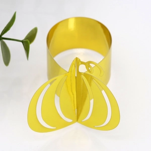 Detailed view of hollow gold pumpkin napkin ring for Halloween festive dining decor