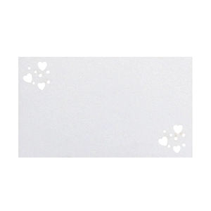 Detail of white rectangle card with laser-cut heart and dot hollow patterns