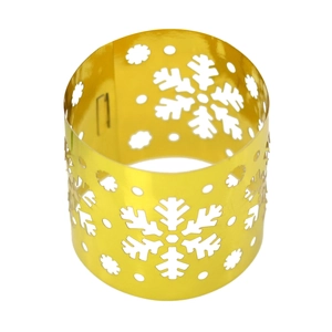 Detailed view of golden napkin ring with snowflake laser-cut hollow pattern for Christmas