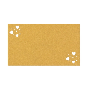 Detail of gold glitter place card with white hearts for wedding table settings