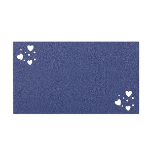 Detailed macro view of dark blue wedding place card with white heart pattern texture