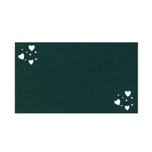 Detail of dark green rectangle place card with white heart pattern and paper fiber texture