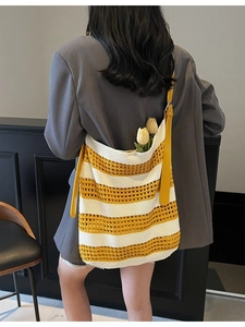 Yellow and white striped crochet tote bag with adjustable leather shoulder strap