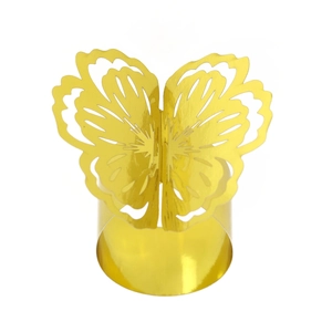 Detail of golden laser-cut butterfly napkin ring with intricate wing patterns