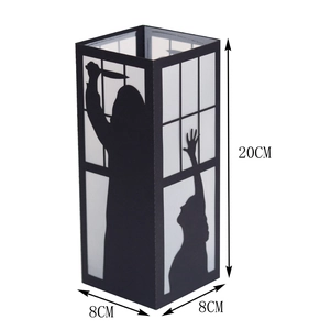 Detailed view of black Halloween paper lantern with spooky silhouettes and 20cm height specs
