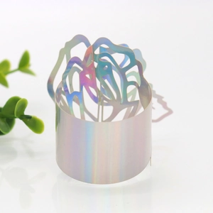 Detail of laser-cut iridescent rose napkin ring with pearl finish and hollow pattern