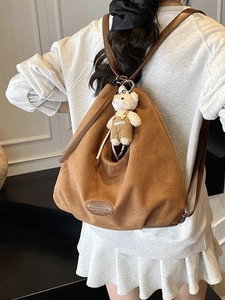 Brown soft faux suede tote backpack for women with a cute beige plush bear pendant
