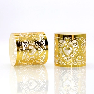 Elegant gold hollow heart napkin rings with laser-cut scroll pattern for wedding decor