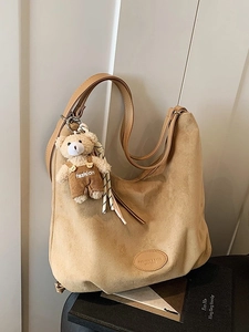 Large camel faux suede tote bag with a cute plush teddy bear charm on textured straps