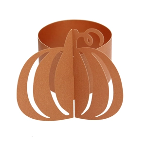 Detail showing the laser-cut orange pumpkin paper napkin ring for Halloween table decor