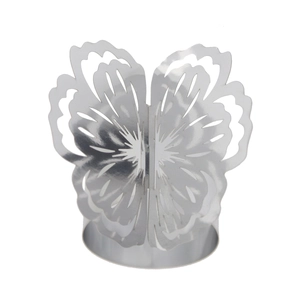 Close-up of laser-cut butterfly napkin ring with intricate floral patterns