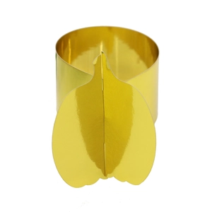 Close-up of golden pumpkin napkin rings made of metallic cardstock for table decor