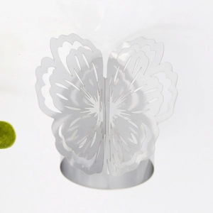 Detailed view of silver butterfly napkin ring featuring intricate hollow carved wings