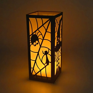 Halloween spider web paper lantern with orange light and laser cut witch silhouette