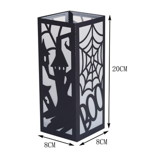 Detail of 20cm black Halloween paper lantern featuring laser-cut castle and spider web designs
