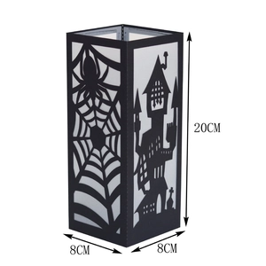 Detail view of black Halloween paper lantern showing 20cm height and spider web cutout