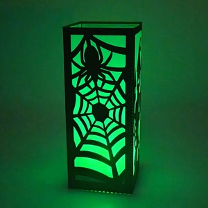Halloween black spider web paper lantern with eerie green glow LED light for spooky decor