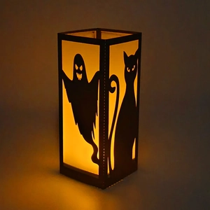 Halloween black witch ghost lantern with silhouettes and warm yellow LED light glow