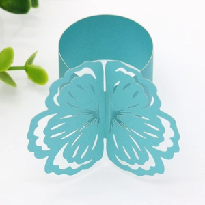 Detailed laser-cut cyan butterfly paper napkin ring for elegant wedding table decor