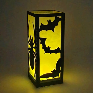 Halloween black paper lantern with warm LED light featuring bat and spider silhouettes